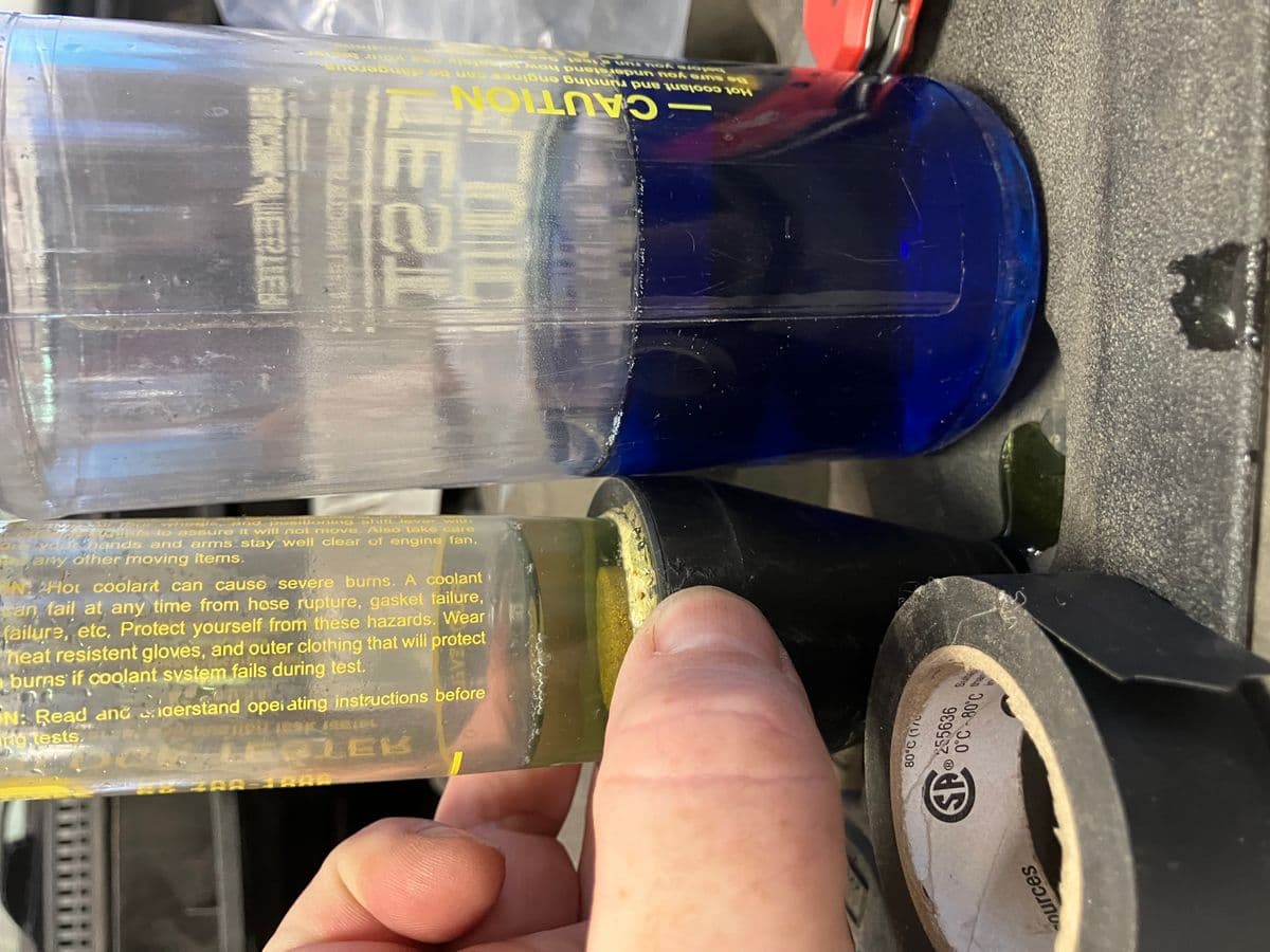 A block tester showing combustion gas in the coolant of a Gen 3 Prius, confirming a head gasket leak