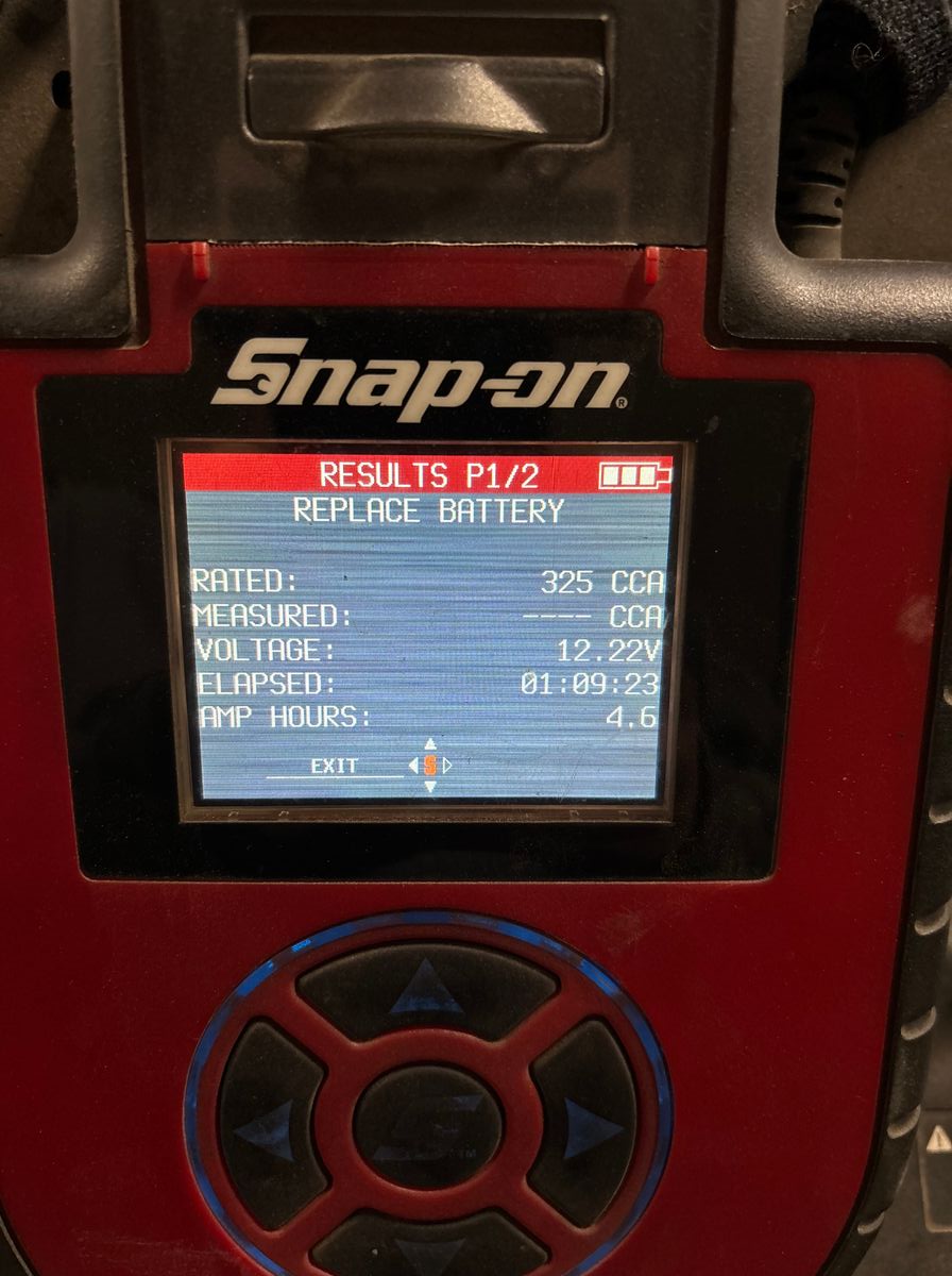 Snap-on battery tester showing REPLACE BATTERY result on 2009 Prius 12v battery