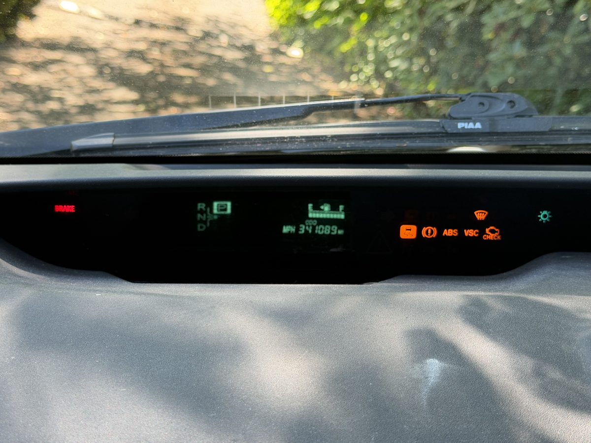Gen 2 Prius dashboard lit up with warning lights caused by a weak 12V battery
