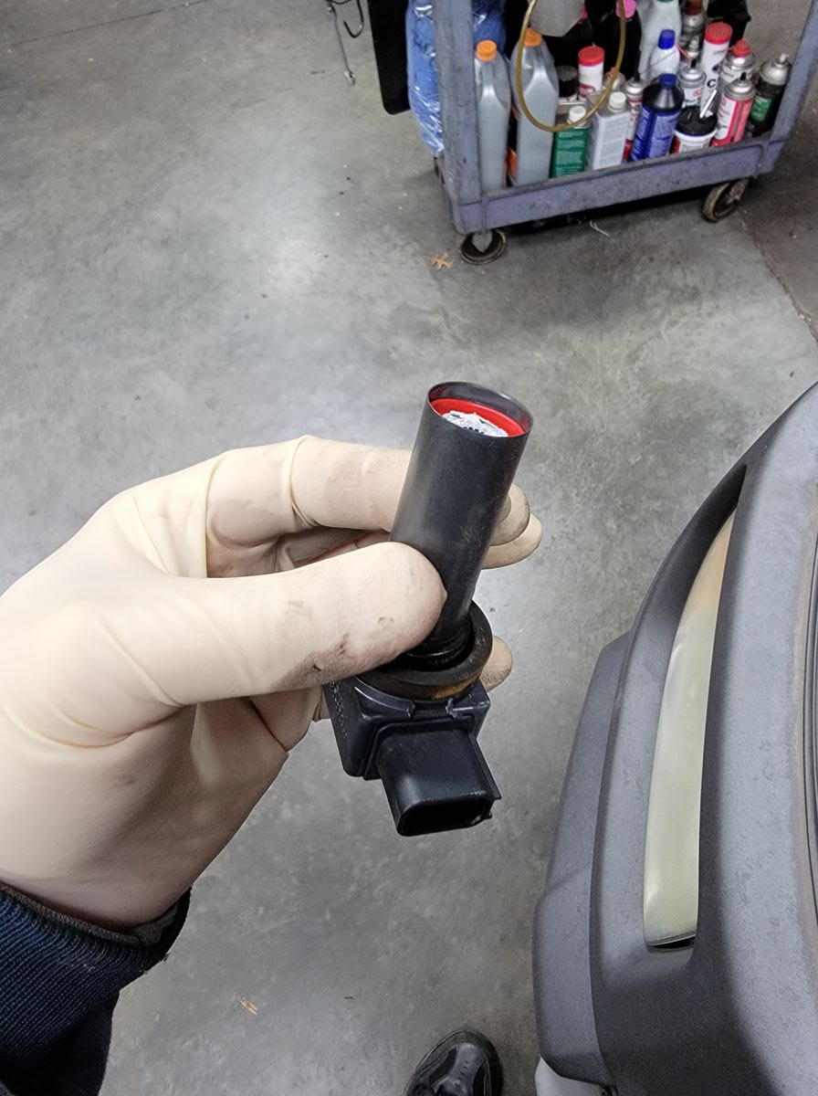Ignition coil that broke in half during removal from an overheated Honda Element engine