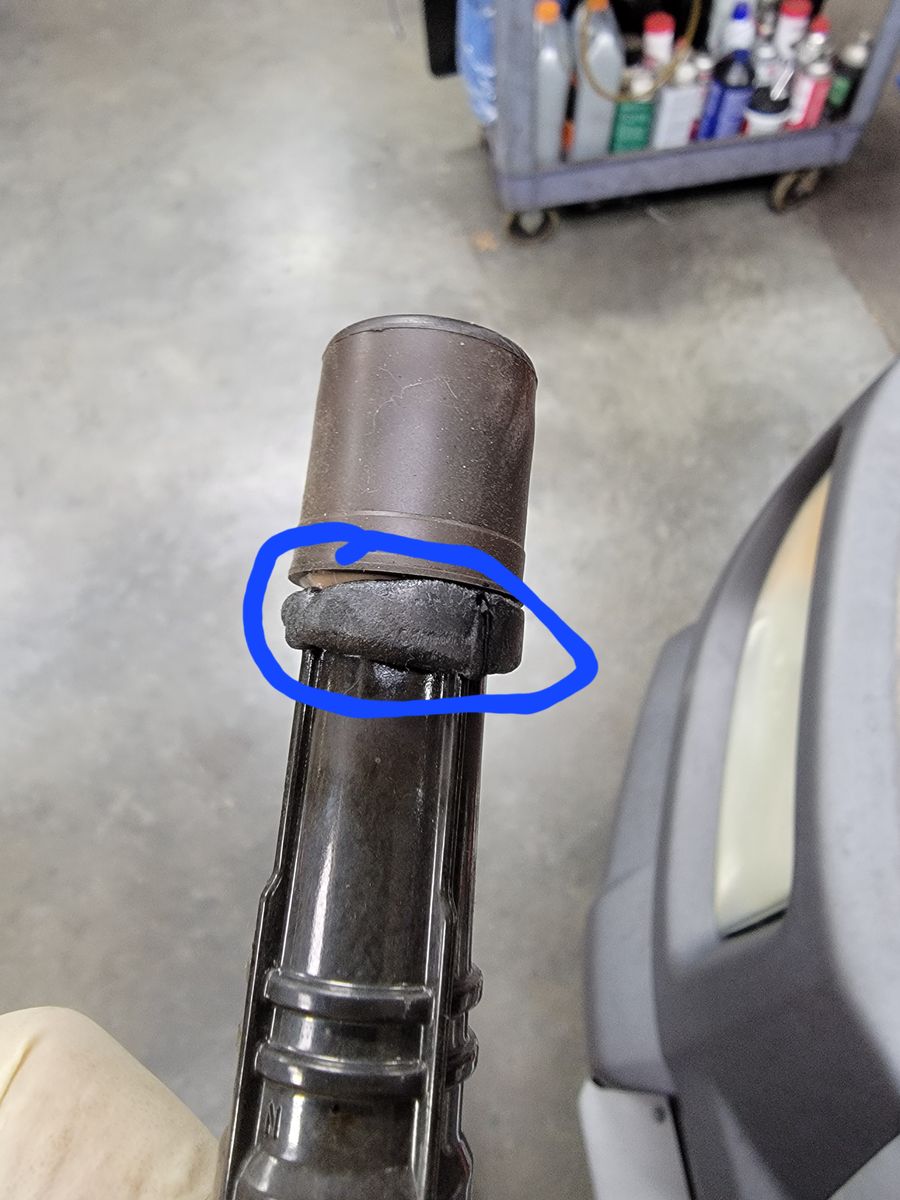 Melted ignition coil boot from a 2005 Honda Element that overheated due to coolant loss