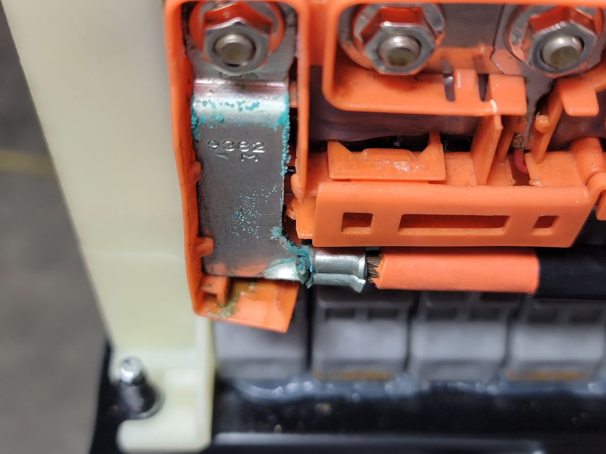 Close-up of corrosion on hybrid battery bus bar in a 2007 Prius