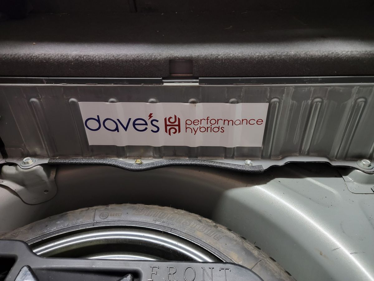 Reconditioned hybrid battery with shop sticker installed in a 2007 Prius