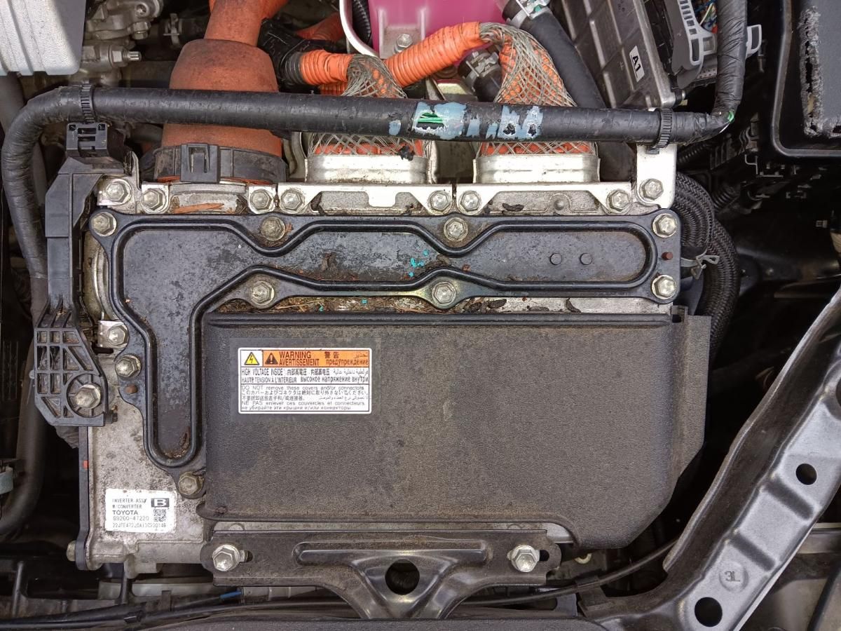 Rodent-chewed wiring above a Toyota hybrid inverter assembly
