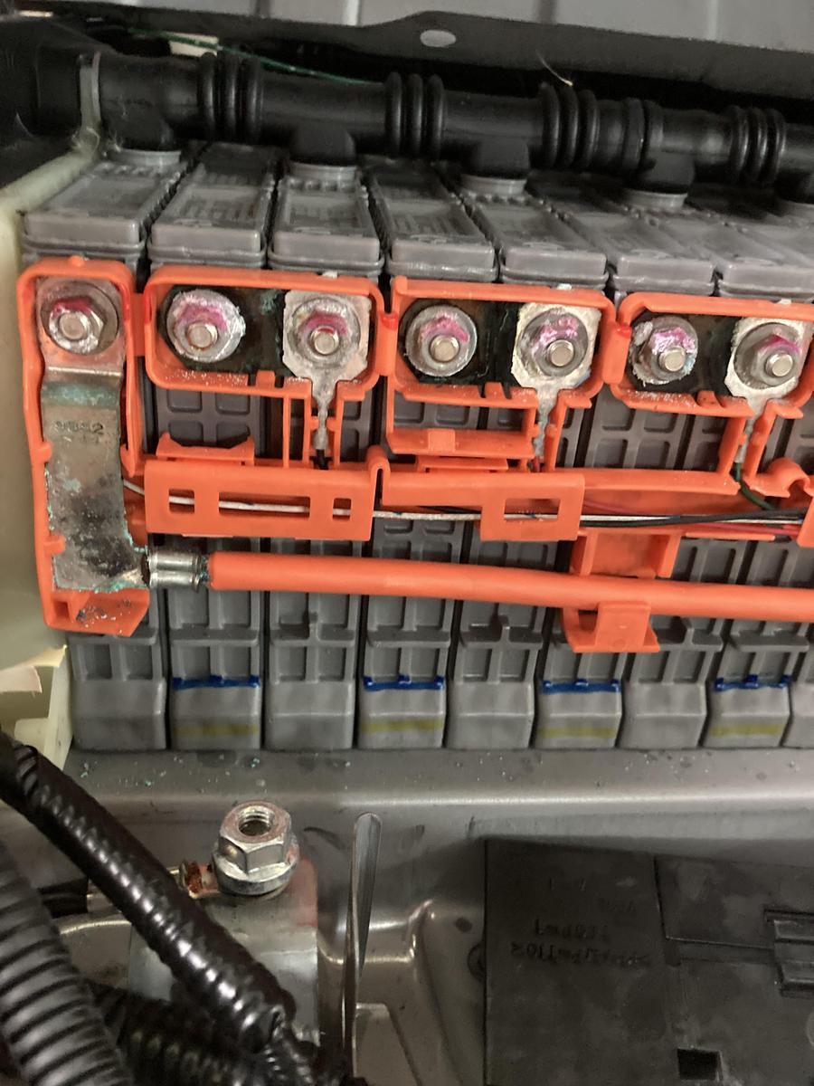 Toyota hybrid battery pack with corrosion on the bus bar bracket and module terminals, a common P0A80 finding